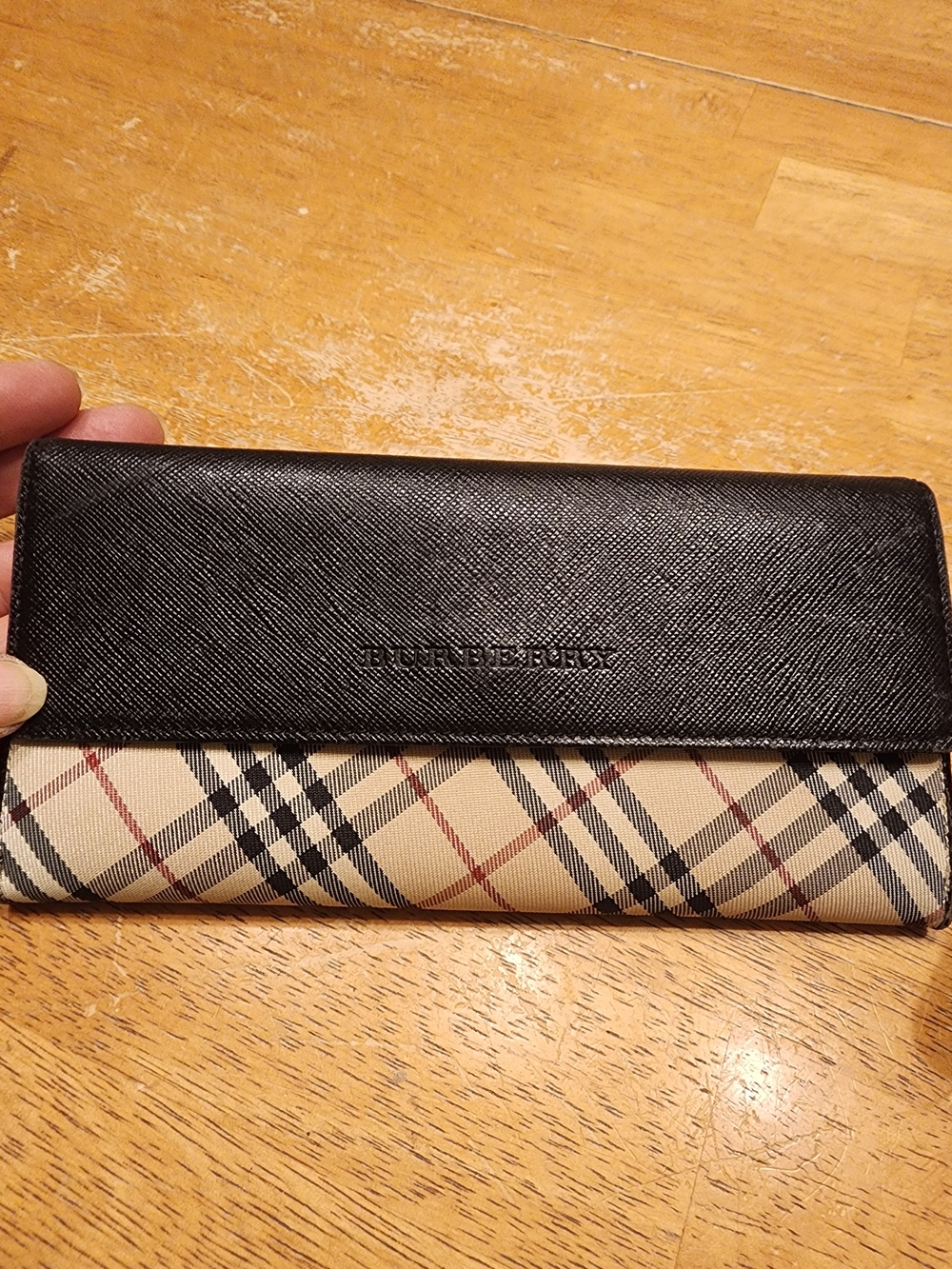 Burberry Nova Check wallet features black textured leather Continental Wallet